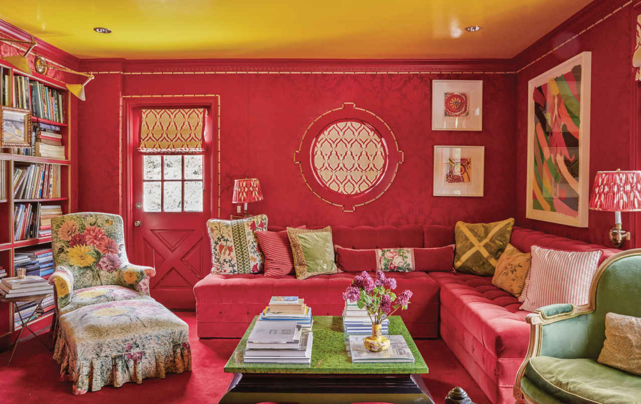 COLOR OVERHEAD. While the whole room is exceptional, the true surprise is the yellow high-gloss ceiling. Most accent walls are actually walls, but for a real lift, painting the ceiling is a high-impact alternative.