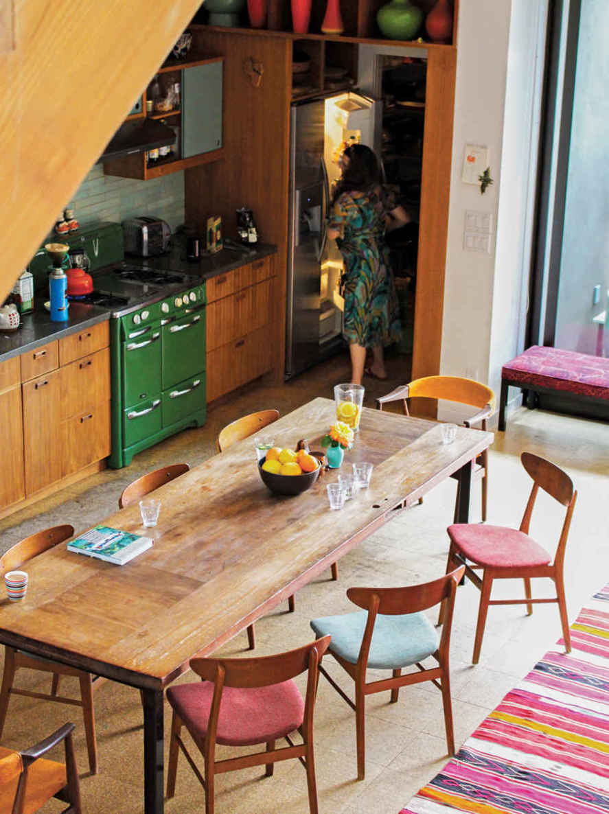 KNOCK. KNOCK. This extra-long table is actually an old door the homeowners had kicking around their art studio. They sanded it down, added legs, and left the top unfinished so that its rustic charm continues to get better with age.