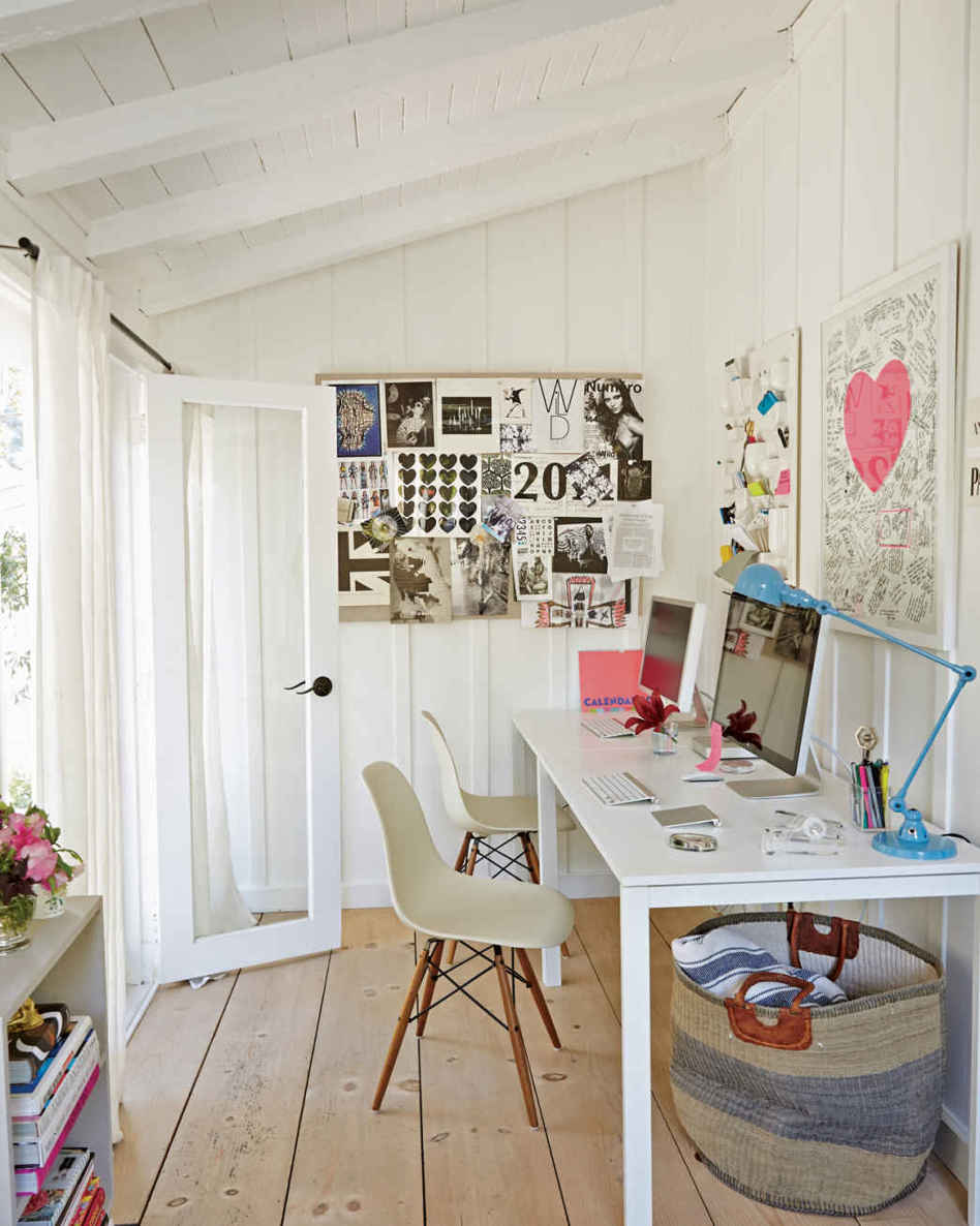 PIN IT. Anne’s black-and-white inspiration board, a throwback to the days before Pinterest, is lovingly collected from magazine clippings, fashion show invites, and photo booth pictures.
