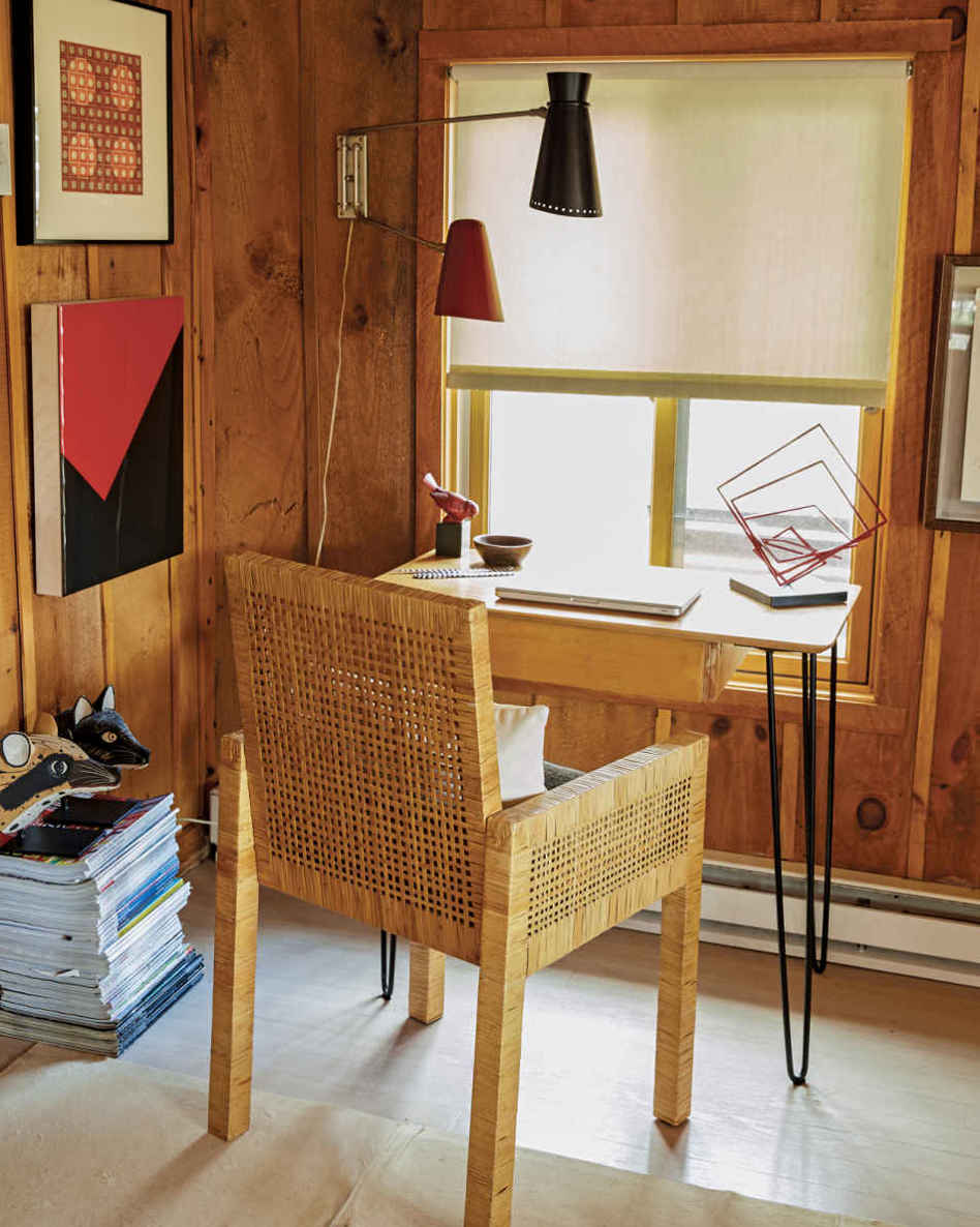 IN THE CLEAR. Mounting a French swivel light on the wall, instead of having a lamp on the desk, clears precious surface space for laptops and keyboards.