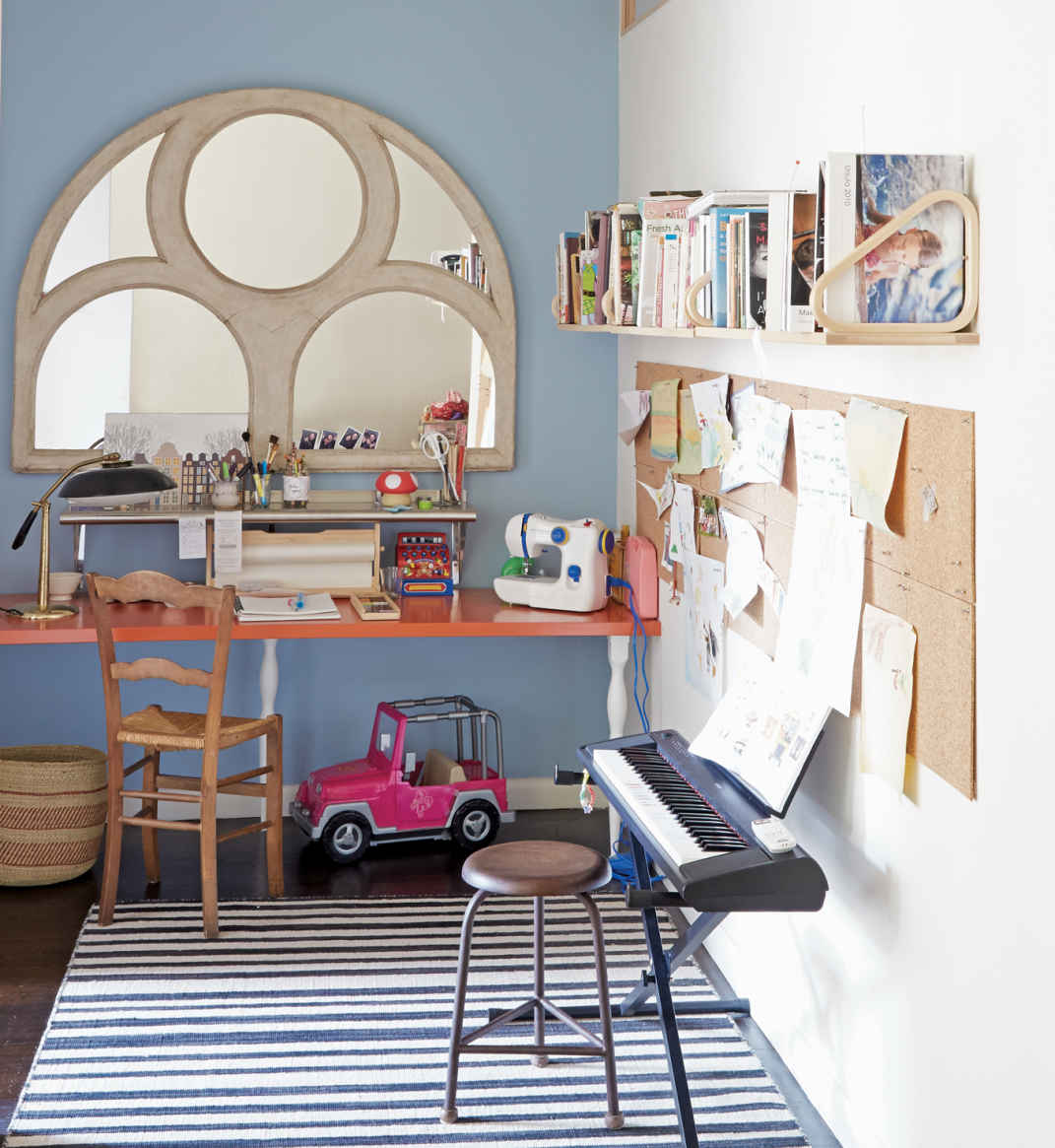 SECOND LIVES. The beautiful, arched mirror that grounds this craft nook was once a church window. Maxwell found it at one of his favorite vintage stores, Bobo Intriguing Objects in Atlanta.