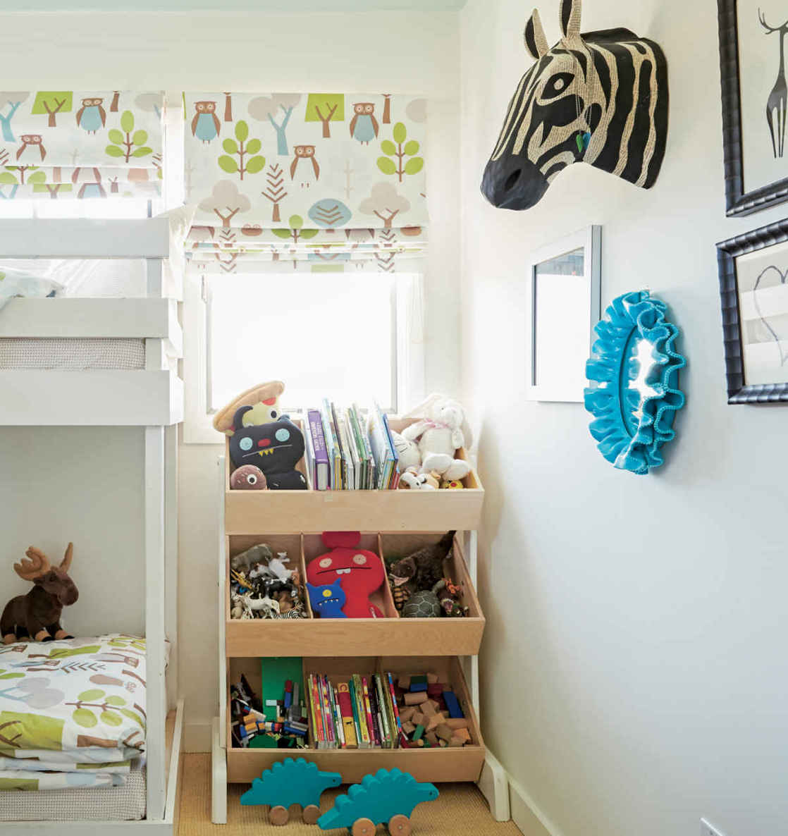 BOX IT UP. Literally called “Toy Store,” this innovative storage unit from Oeuf tucks neatly in the corner, mimics a store display, and makes pulling out toys (and putting them away) a cinch.