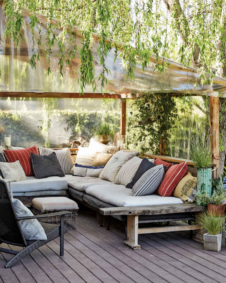 COMFY CORNER. Part of the L-shaped nook is currently topped with a few pieces of fiberglass. It allows plenty of light to pass through, so a thick and fragrant vine can continue to grow in the space.