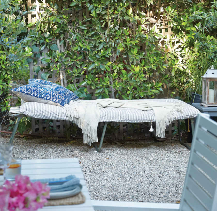 DAY BED. A simple army cot is turned into a far more luxurious destination when topped with a soft, down-filled, linen “throwbed” by Hedgehouse. The look could be very “princess in the pea” if you were to stack multiple beds on top of one another.